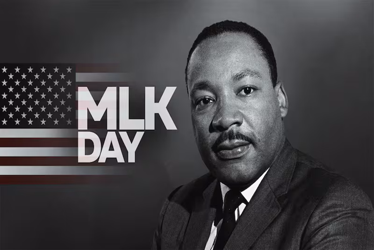 Dr. Martin Luther King, Jr next to an American flag with letters MLK day all in black and white
