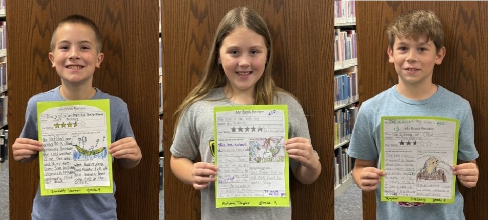 three fourth grade students show their book reviews