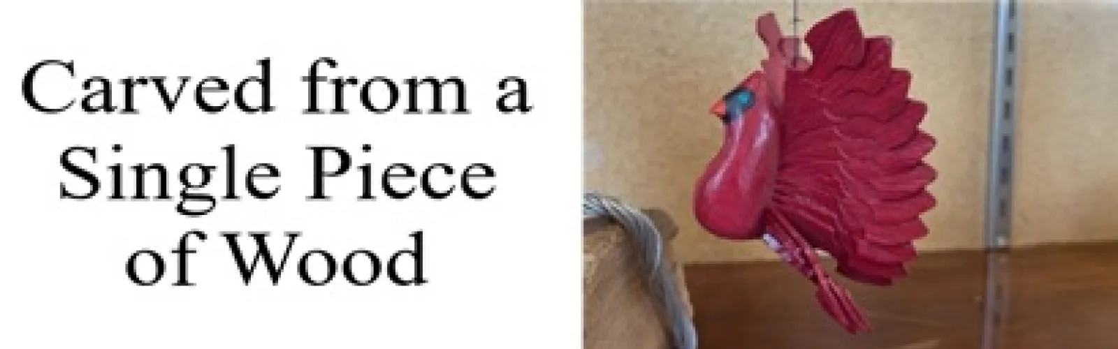 red cardinal carved using the folk art method fan carving