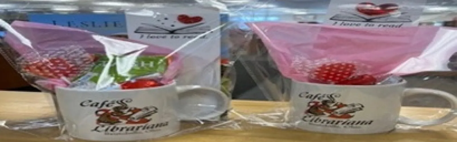 clear package with a mug, bookmark, tea bags, and chocolate inside of it